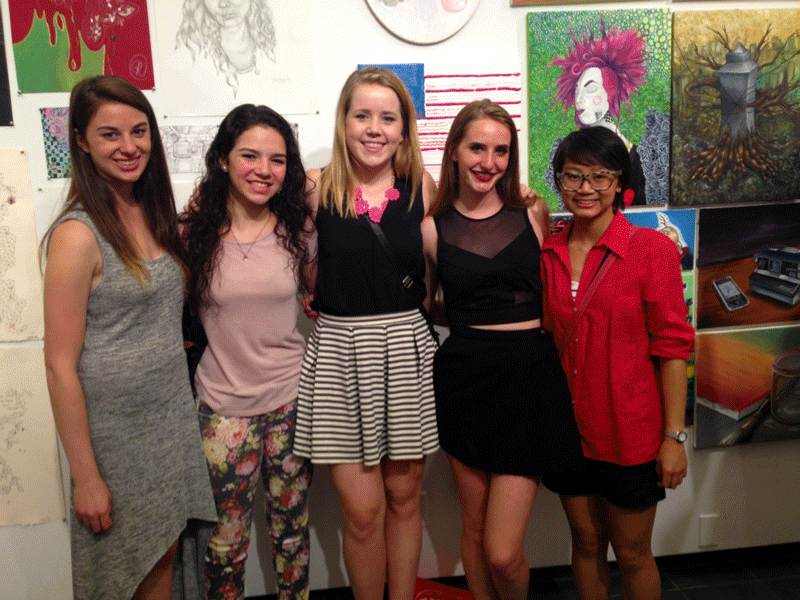 Gifford and her roommates in front of her artwork on display at SVAs gallery showing. Her roommates came from all over: Boston, Florida, Milan. 