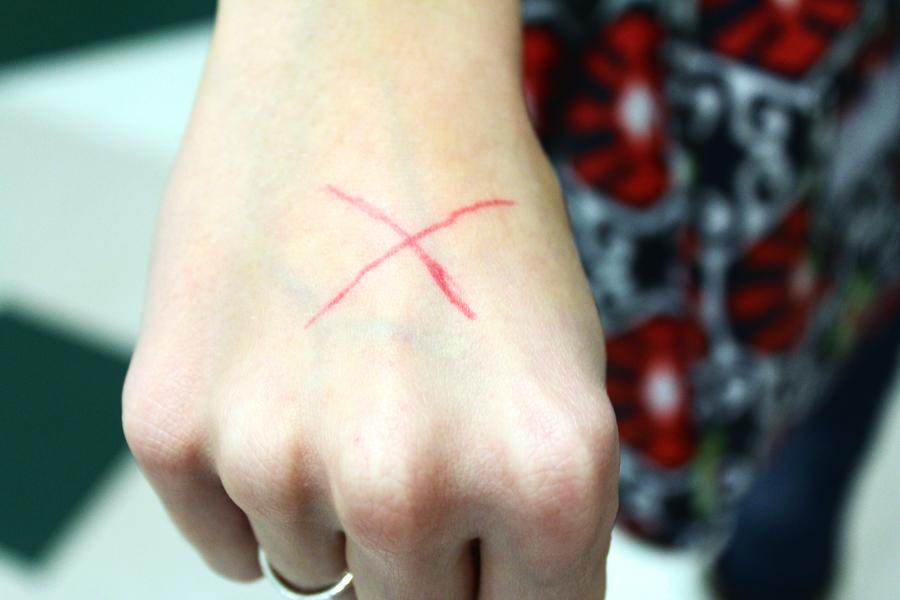 Sophomore Megan McRee drew an X on her hand.