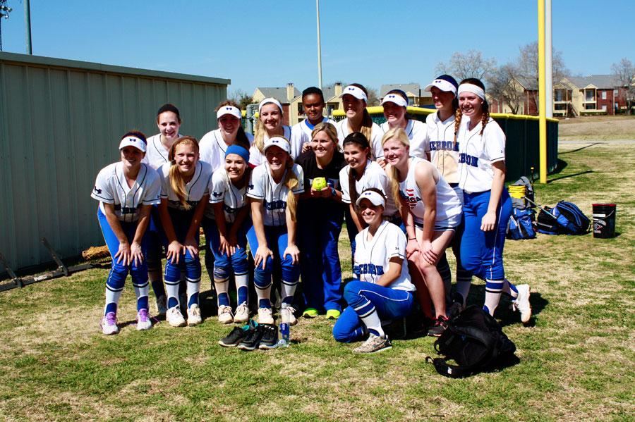 Head+Coach+Staci+Jackson+was+presented+with+a+signed+game+ball+for+her+one+hundredth+win.+