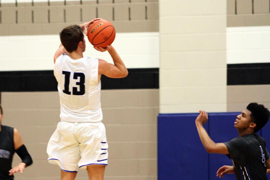 Junior guard Tim Hart rises up for a shot after he was left open at the top of the key.