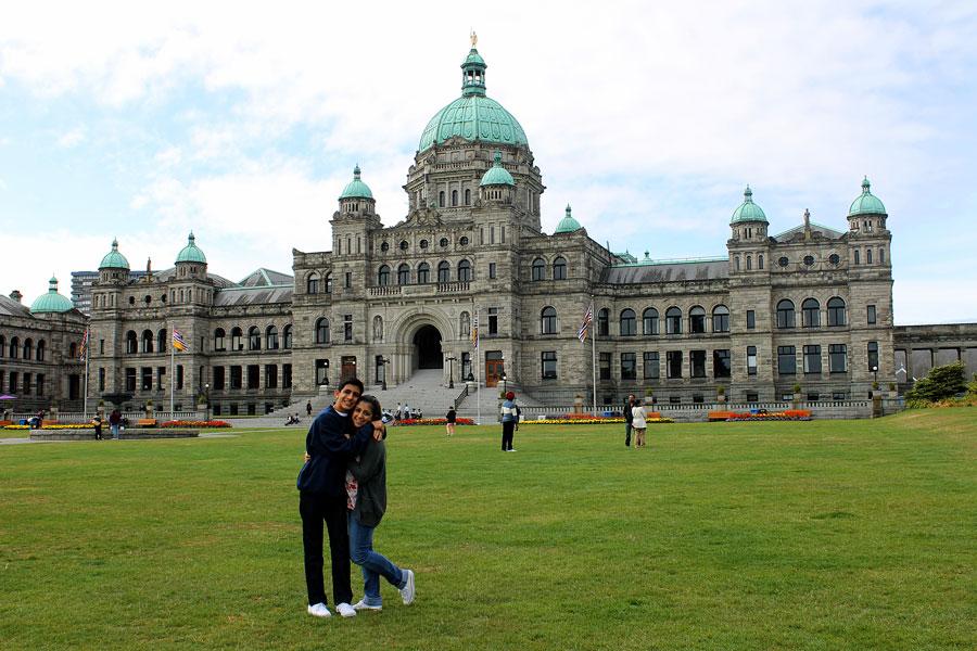 Bordbar and his sister in front of the British Columbia Parliament Buildings located in Canada. 