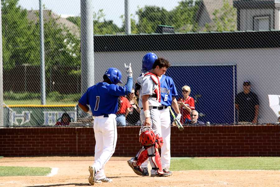 Lloyd celebrates at home plate after blasting a solo home run over the left field wall in the fourth inning.