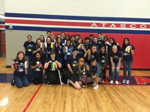 The team poses with their awards after a successful competition at Atascocita High School.