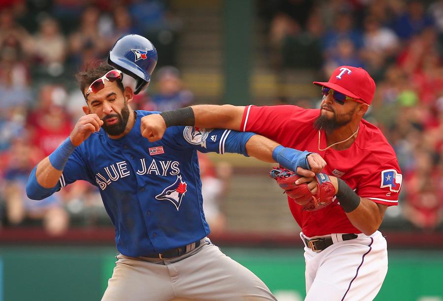 Toronto Blue Jays Jose Bautista (19) gets hit by Texas Rangers second baseman Rougned Odor (12) after Bautista slid into second in the 8th inning at Globe Life Park on May 15, 2016 in Arlington, Texas. The Rangers won 7-6. (Richard W. Rodriguez/Fort Worth Star-Telegram/TNS)