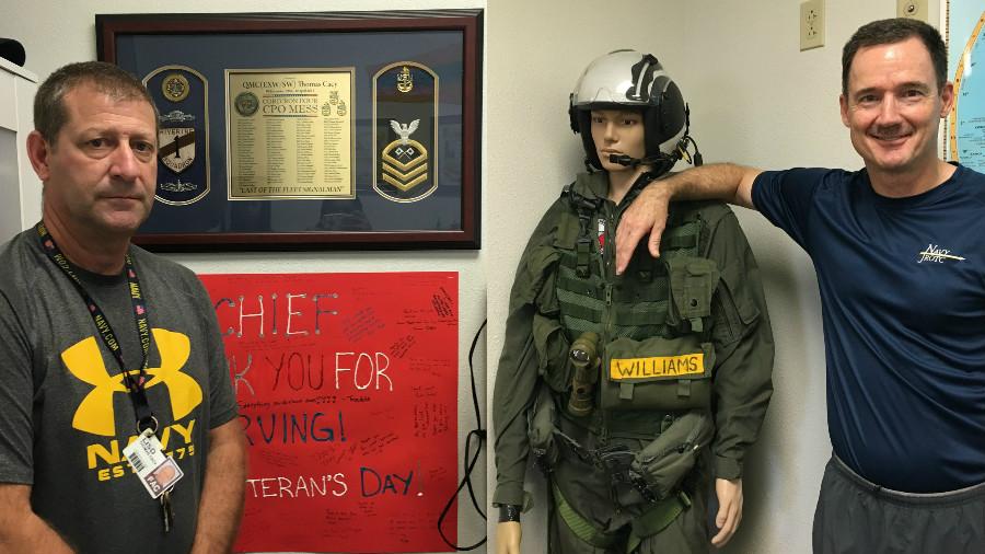 Captain Cacy (left) and Commander Williams (right). Commander Williams poses with his old uniform.