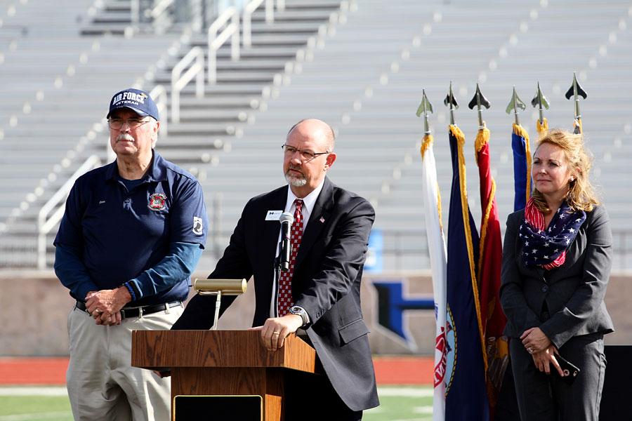 Principal Scot Finch addresses the students and teachers about the importance of Veterans Day. Finch was flanked by a Vietnam War veteran and ninth grade campus principal Amanda Werneke.