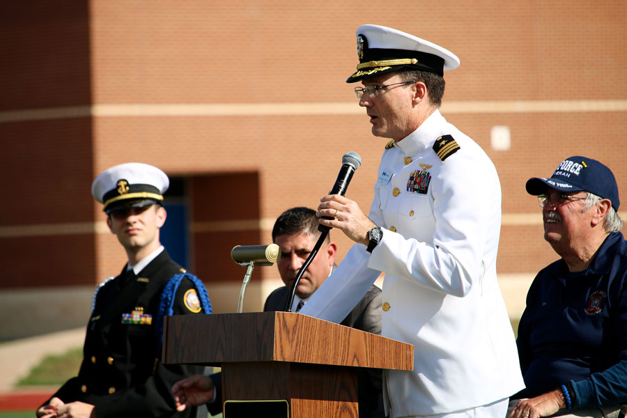 Commander Jeff Williams introduces the current commanding officer of JROTC, Konnor Halteman (far left). Halteman recited My Name Is Old Glory as other members of JROTC performed the ceremony.