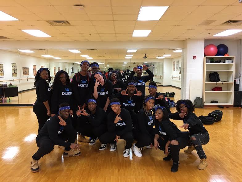 The step team gathers together before their first performance. 