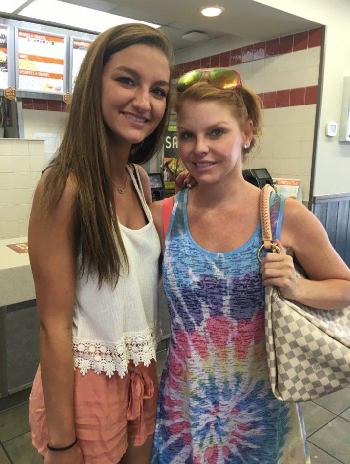 Cammarota stands next to Real Housewife of Dallas star Brandi Redmond. Cammarota met Redmond at Whataburger.