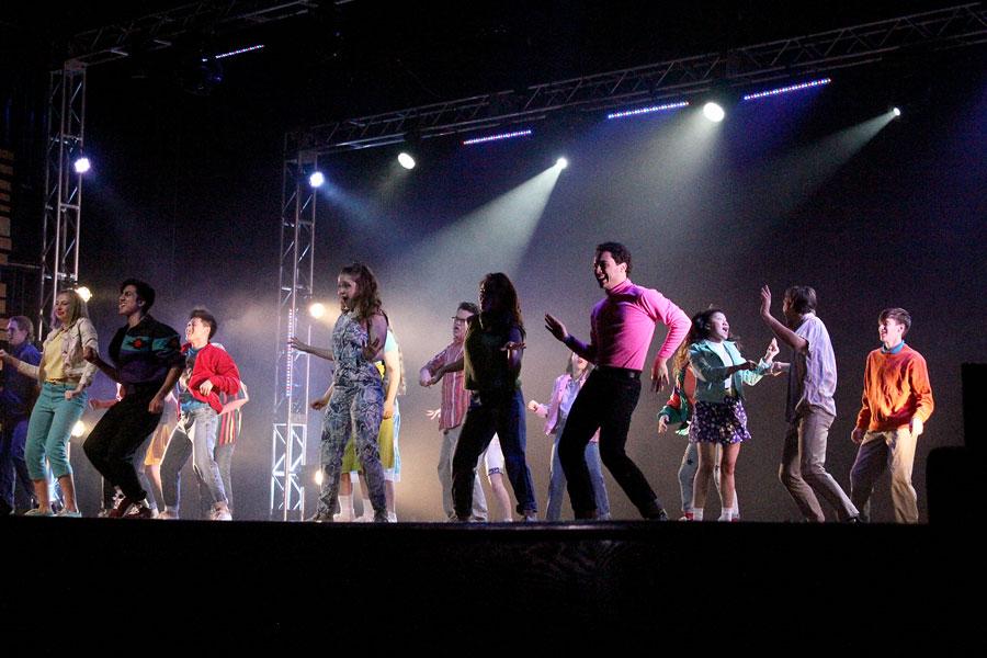 The+opening+scene+took+place.+Members+of+the+cast+danced+and+sang+the+most+well+known+song+from+the+play+Footloose.