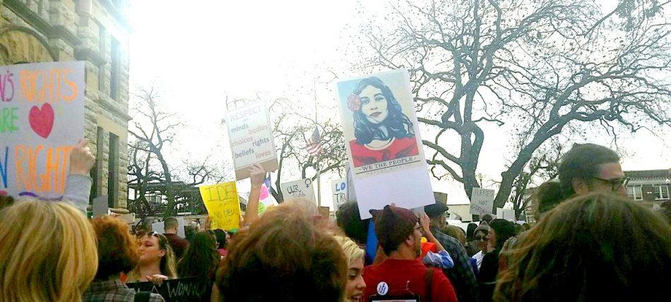 Protesters holding up their signs at the rally held in Denton.