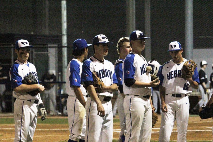 The Hawks practice together before the game. Before every inning, the team huddles up to make a game plan.