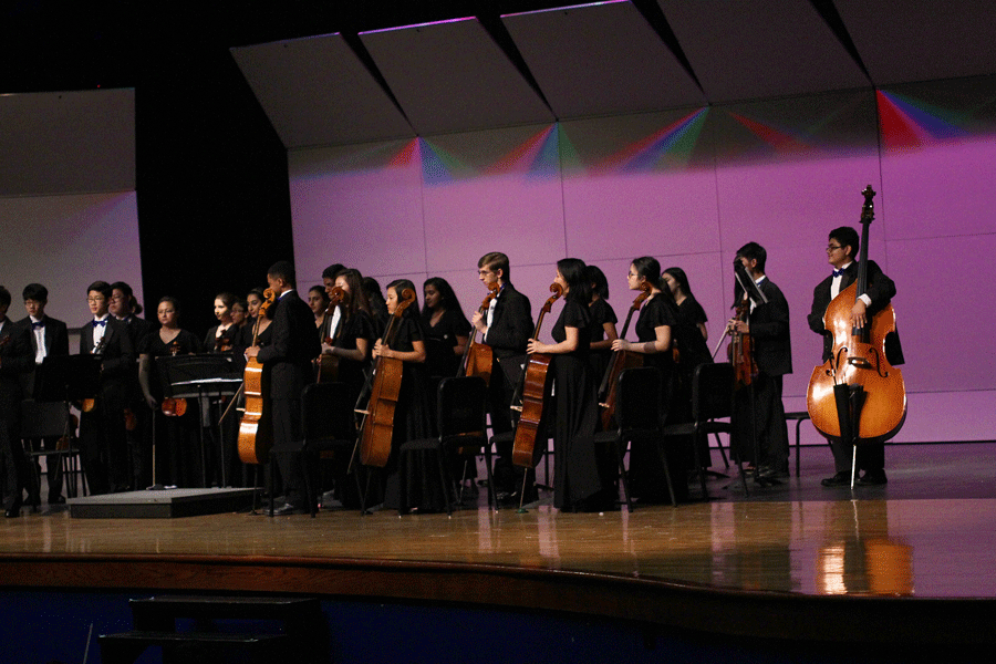 Symphonic Orchestra standing after finishing their set. The Chamber Orchestra was joined by several members of the Hebron Band to perform three songs.