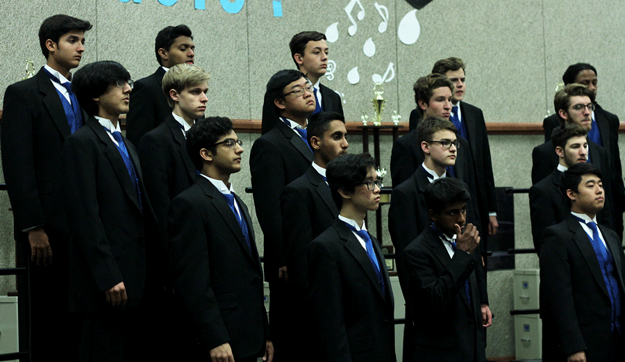 A Capella men practicing their music. They were preparing to leave for Denton HS during second period.