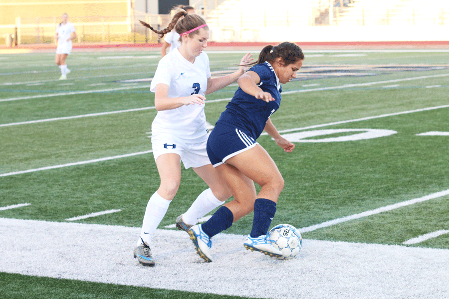 Senior Megan Sherman blocks her opponent from passing.