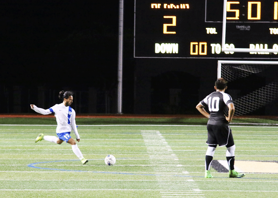 Senior Jaime Guzman takes a penalty kick for Hebron.