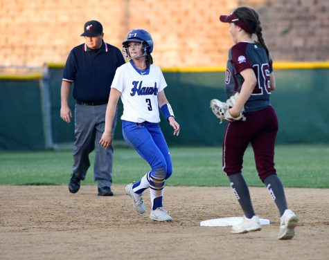 Senior Sydney Streenz stays close to second base as she watches her teammate bat. Streenz was trying to steal third base, but the inning ended before she could.