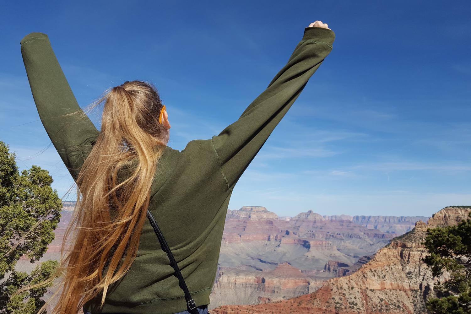 Wrestler poses at the Grand Canyon. Wrestler says loves to travel and going outdoors; she believes that by being in the Navy she will be able to get both.