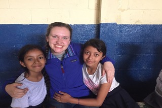 Sydney poses with two girls she met in Guatemala. She met them during a bible study program. 