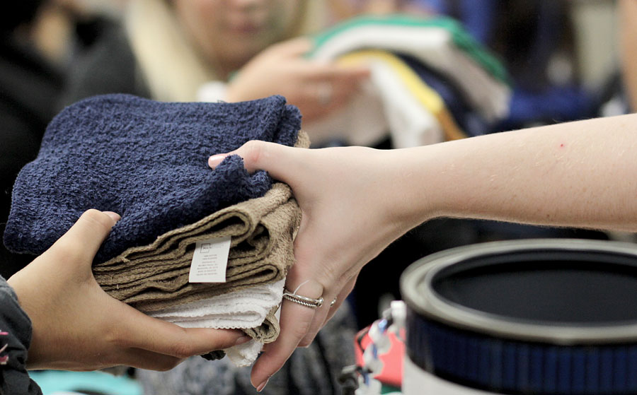 Student council members create care-packages with items like washcloths.