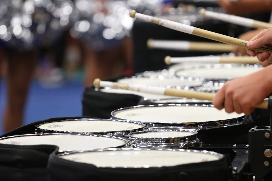 The+drumline+warms+up+for+the+pep+rally.+They+were+preparing+for+the+pep+rally+as+well+as+their+first+contest.