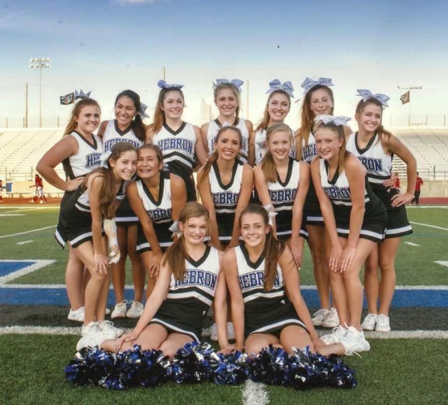 Newman (middle row left) poses with her cheer friends for a photo. This was before her accident. 
