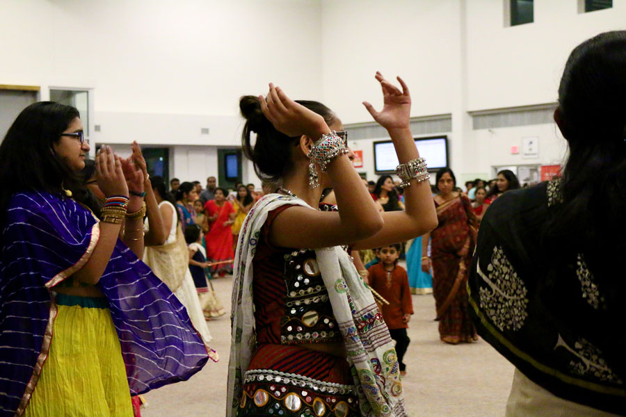  At the Hanuman Temple, people dance in a circle and clap as they follow the beat of the music.