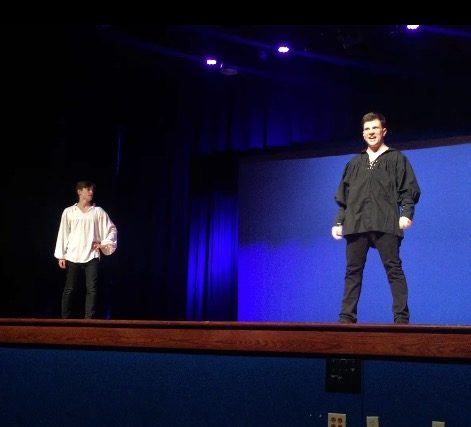 Junior Joseph Hoffman and senior Caleb Geddie perform Bottoms Gonna Be On Top. Hoffman played Nick Bottom, and Geddie played Will Shakespeare.