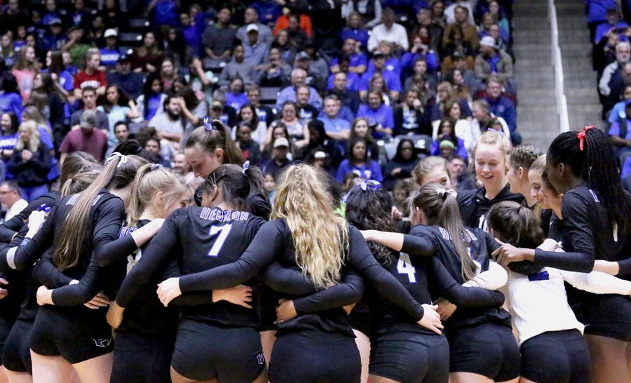 The Lady Hawks huddle together before the game starts. This is their third time winning state in a row. 