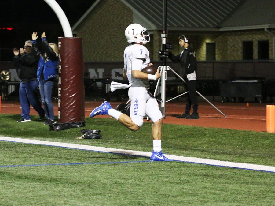 Senior Clayton crosses into the endzone to score a touchdown for Hebron. 