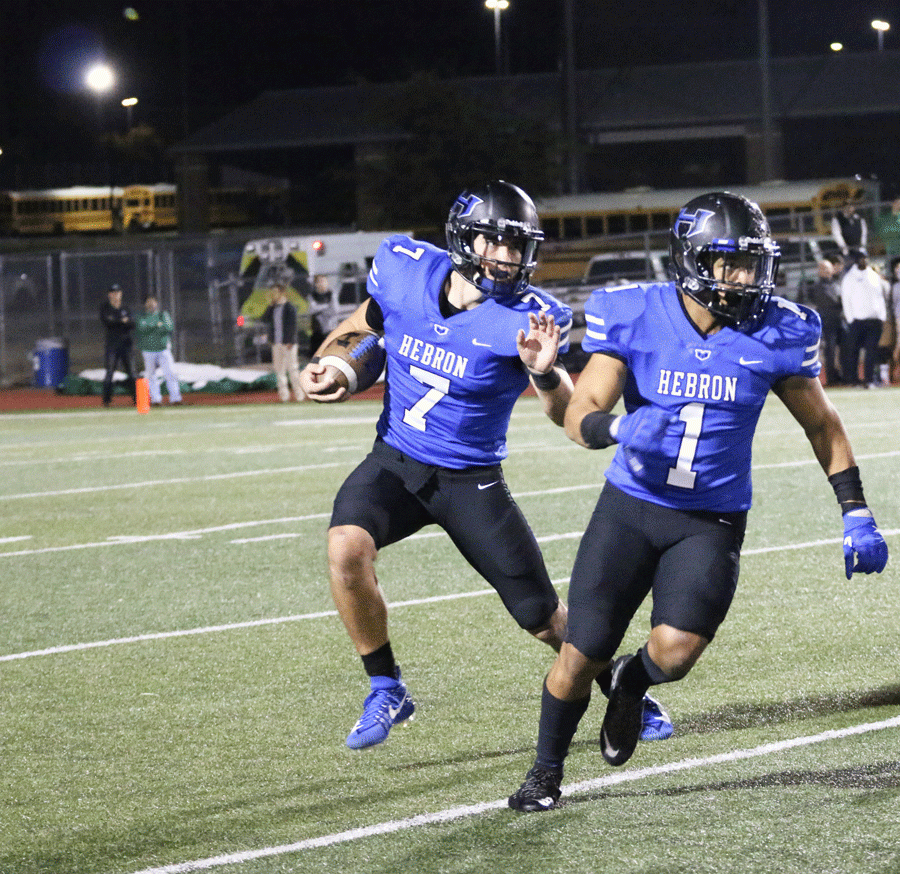 Senior quarterback Clayton Tune rushes and makes a first down for Hebron.