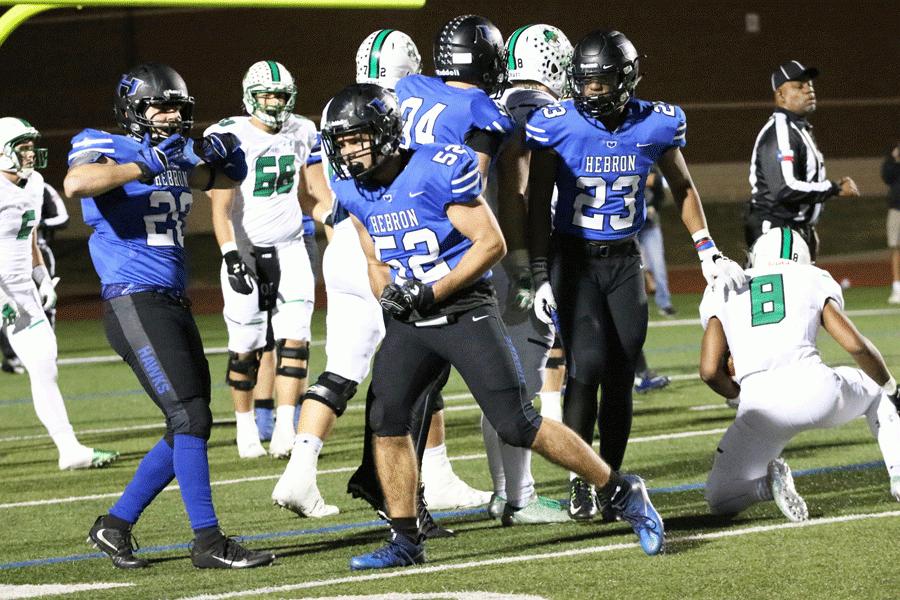 Junior middle line backer Colby Newton and the defense push back Southlake.