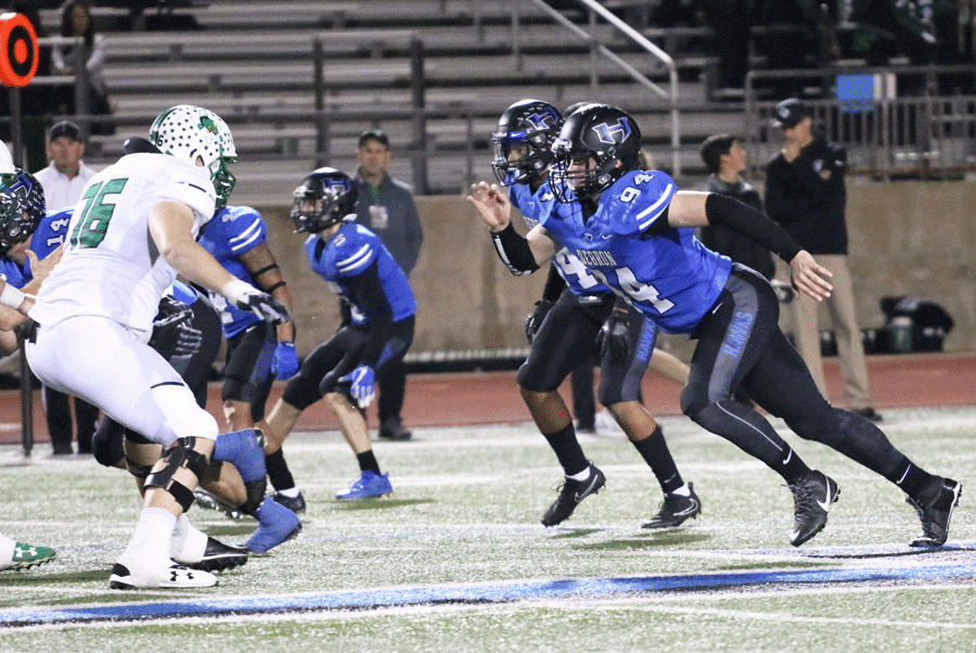 Junior defensive end Cole Phillips moves to stop a Southlake player.
