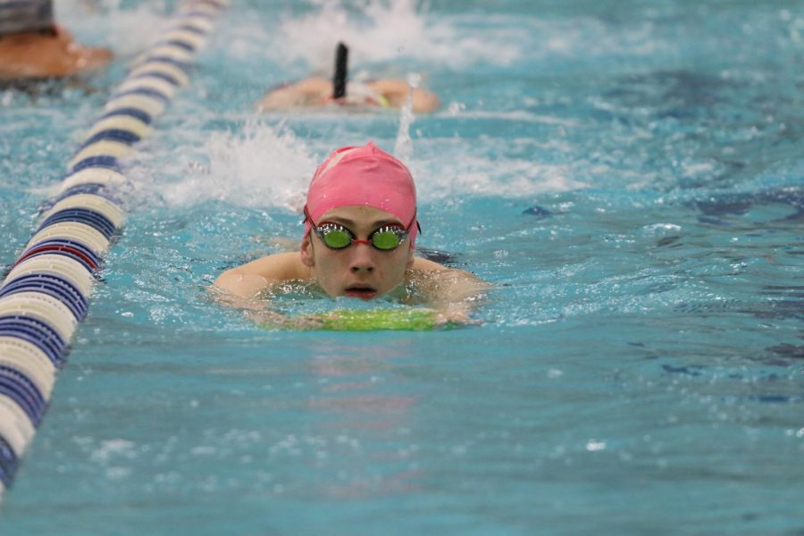 Senior Clay Calhoun practices kicking during practice. The meet will be held on Dec. 19 at the LISD Eastside Aquatic Center.