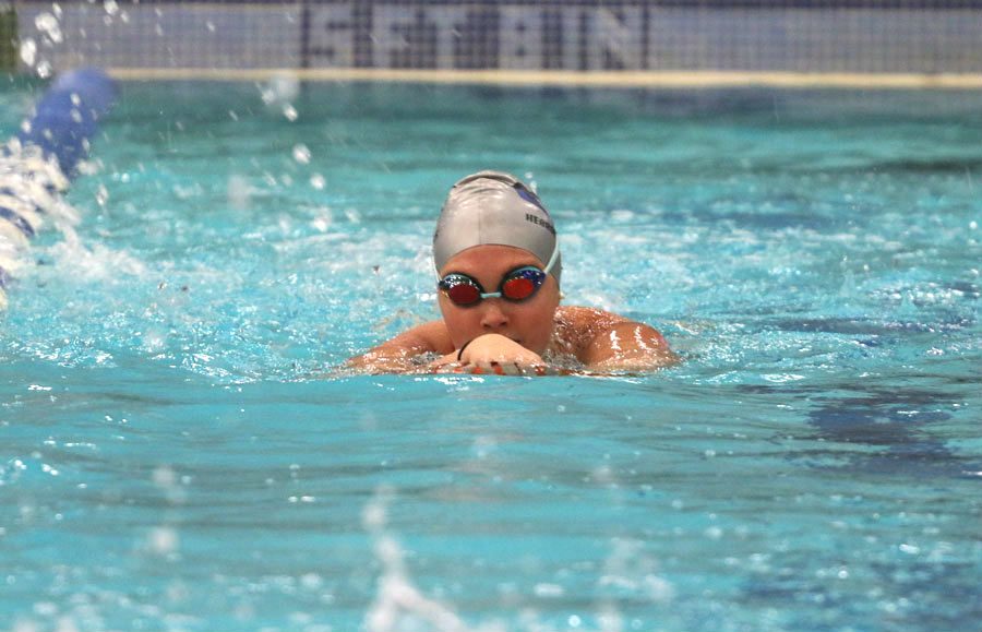 Senior Mackenzie Garcia practices her kicking technique during morning practice. This is Mackenzies fourth year on the Hebron swim team.