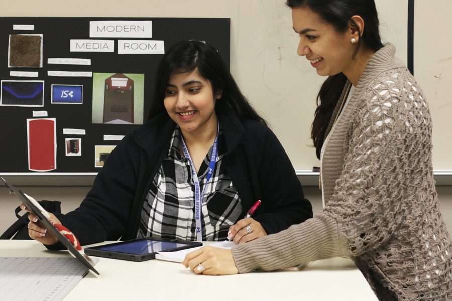 Senior Inaya Kara works on a project with Interior Design I teacher Jacqueline Rans. Kara is in the pilot class for Interior Design II.