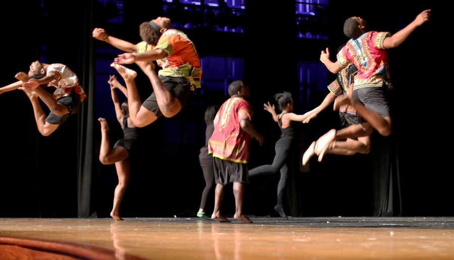 Showtime members jump in the air as part of their dance. The celebration addressed social issues such as racism.