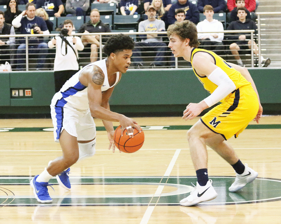 Senior Courtney Murrell dribbles the ball past a McKinney defender. 