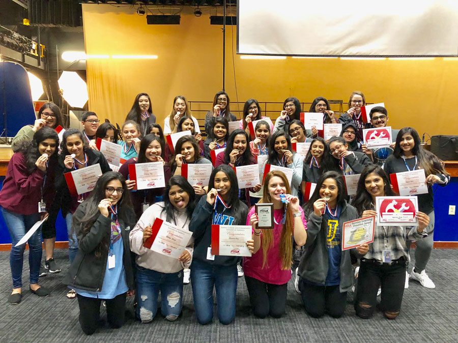 FCCLA+poses+for+a+picture+with+their+medals.+They+competed+in+regionals+on+Feb.+23.