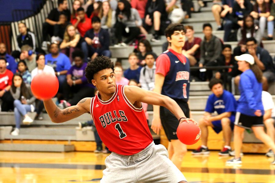 Senior Courtney Murrell aims to throw a ball toward the other senior team. His team won the second round of the tournament.