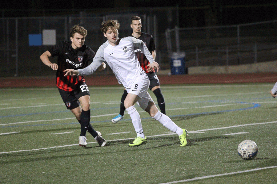 Senior Bryce Brown intercepts the ball and prepares to run it down the field. 