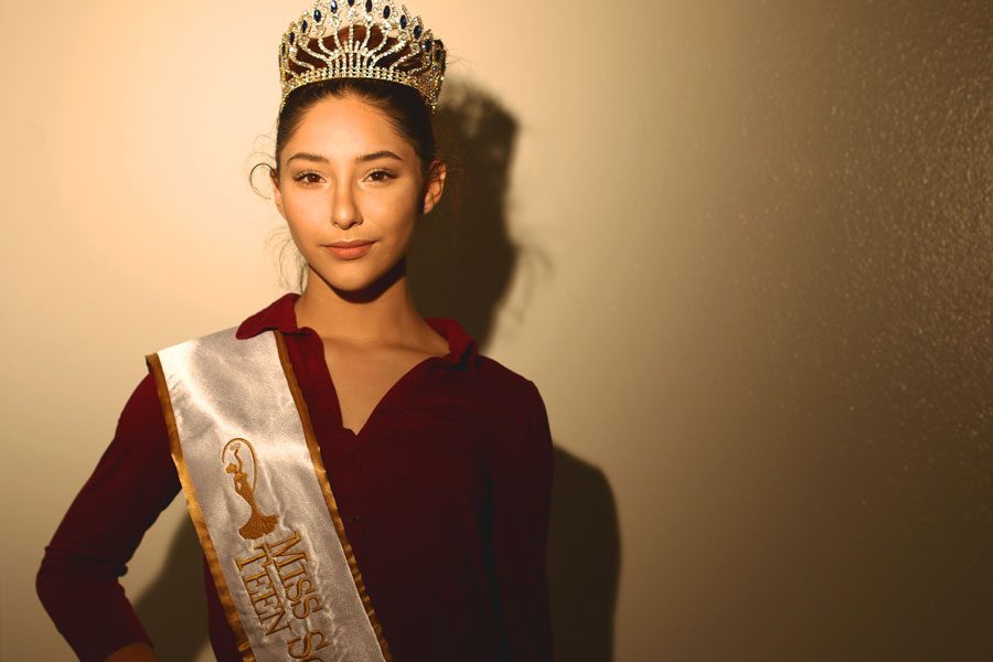 Junior Victoria Zarate poses with her crown and official Miss Teen Sovereign sash. Other than pageantry and DFC, Zarate is also involved in scuba diving, soccer, dance outside of school, and many other activities.