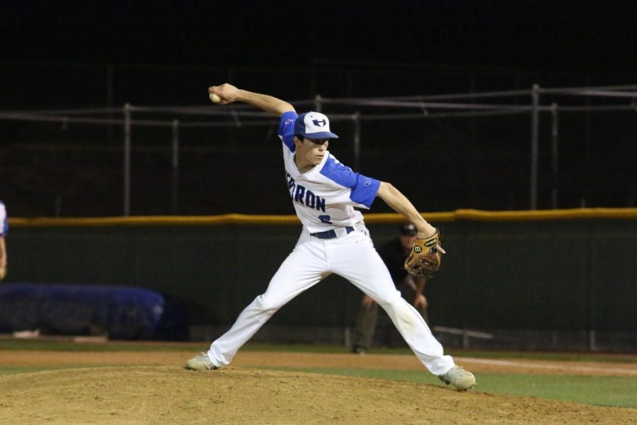 Before the season ended last year, senior Michael Betrus pitches for the Hawks.