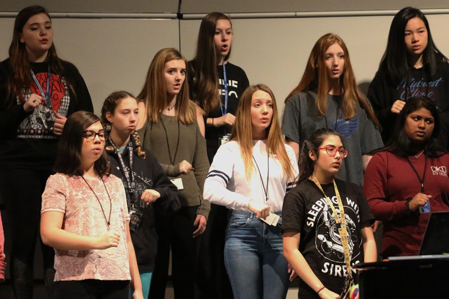 Concert Womens choir practices sight reading during school. They will be one of the groups performing at UIL.