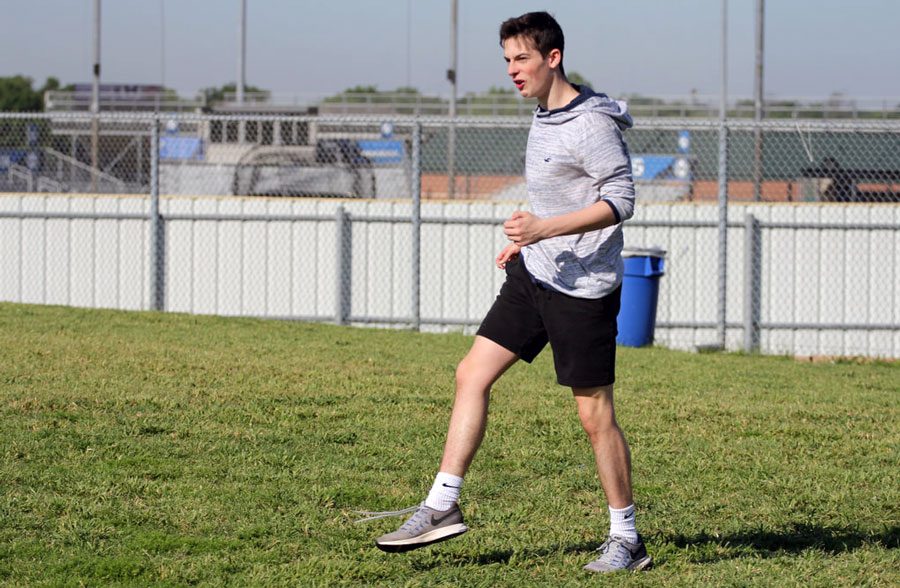 Sophomore Conner Schaefer watches where he kicked the ball on the field during a kickball game on May 10. He was frustrated when someone caught it. I was having fun playing kickball, Schaefer