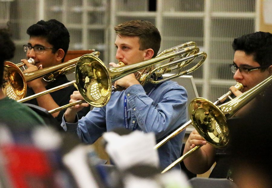 Sophomore+Andrew+Carroll+looks+at+his+music+sheet+as+he+plays+his+bass+trombone.+He+received+an+Outstanding+Soloist+at+the+State+Solo+UIL.+