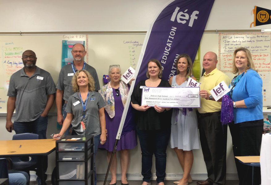 English 4 teacher Jeanny Haneline receives her LEF grant from the Hebron administration. 