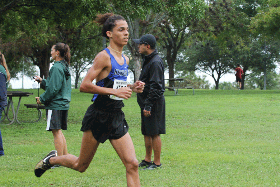 Senior Jayce Turner runs the Boys Gold race at the McNeil Cross Country meet. Turner placed 20th overall, with a run time of 15:26.86. 