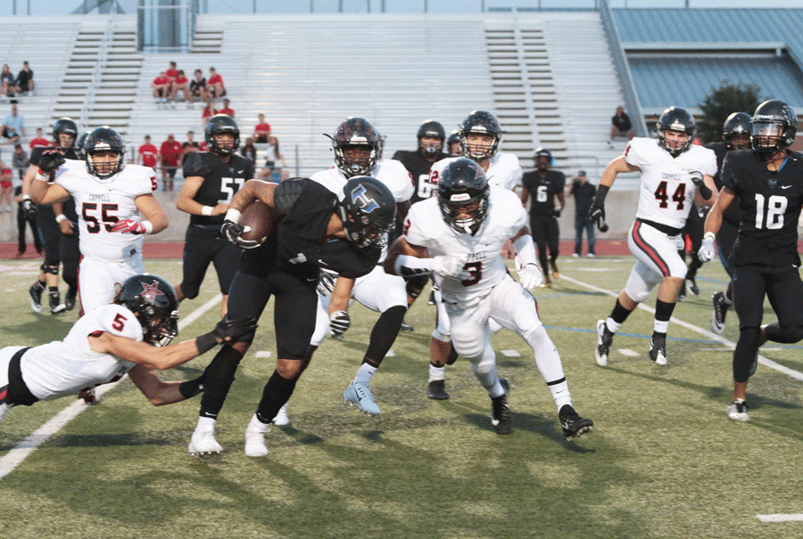 Senior wide receiver Trejan Bridges dodges Coppell players in order to run the ball up the field. 