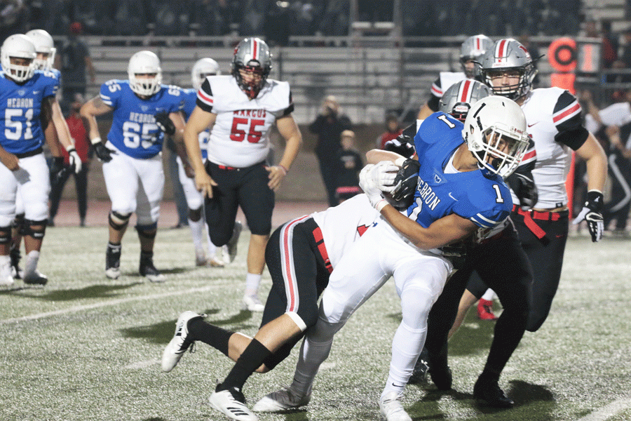Senior wide receiver Trejan Bridges dodges Marcus players in order to run the ball up the field. 